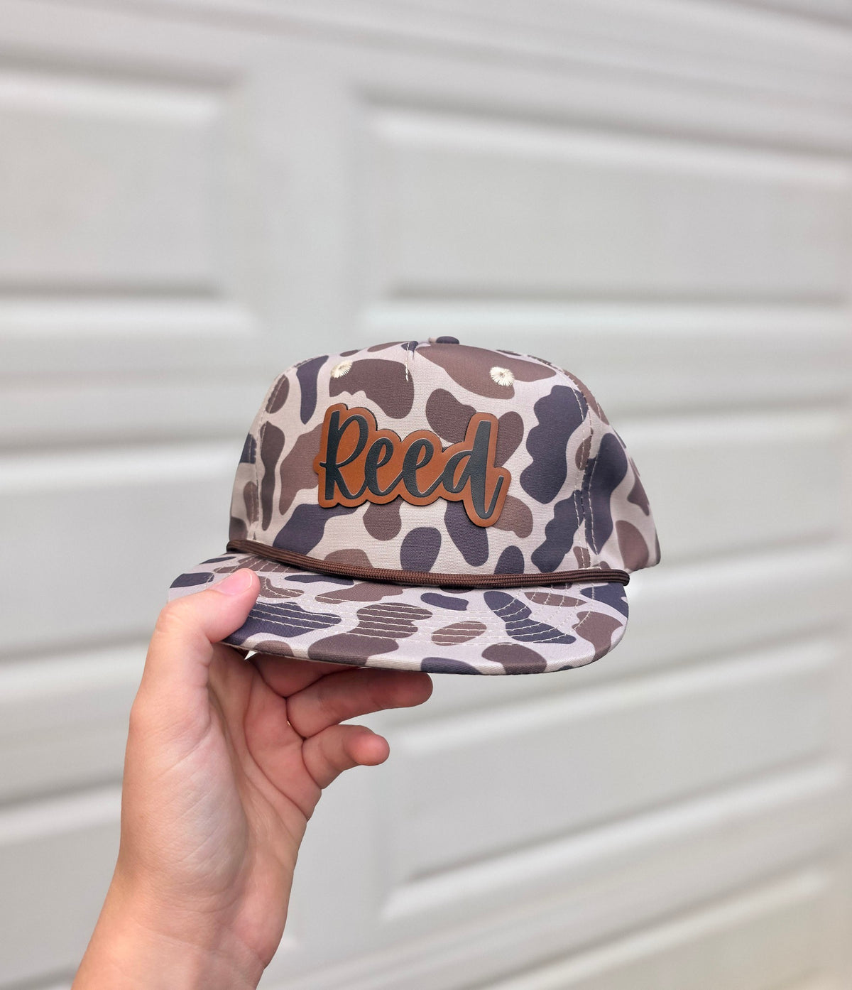 Personalized youth camo rope hat with custom layered name patch