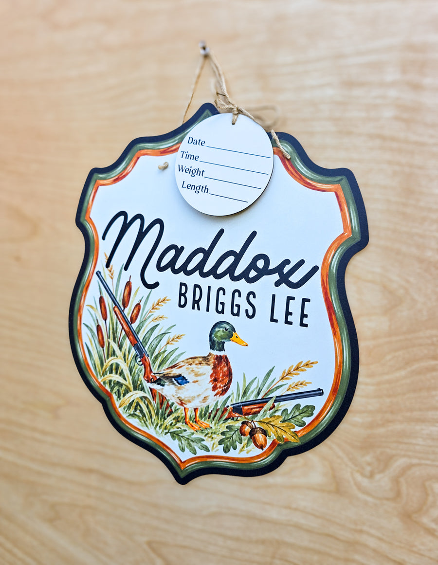 Watercolor mallard duck surrounded by cattails and marsh grasses on baby name sign