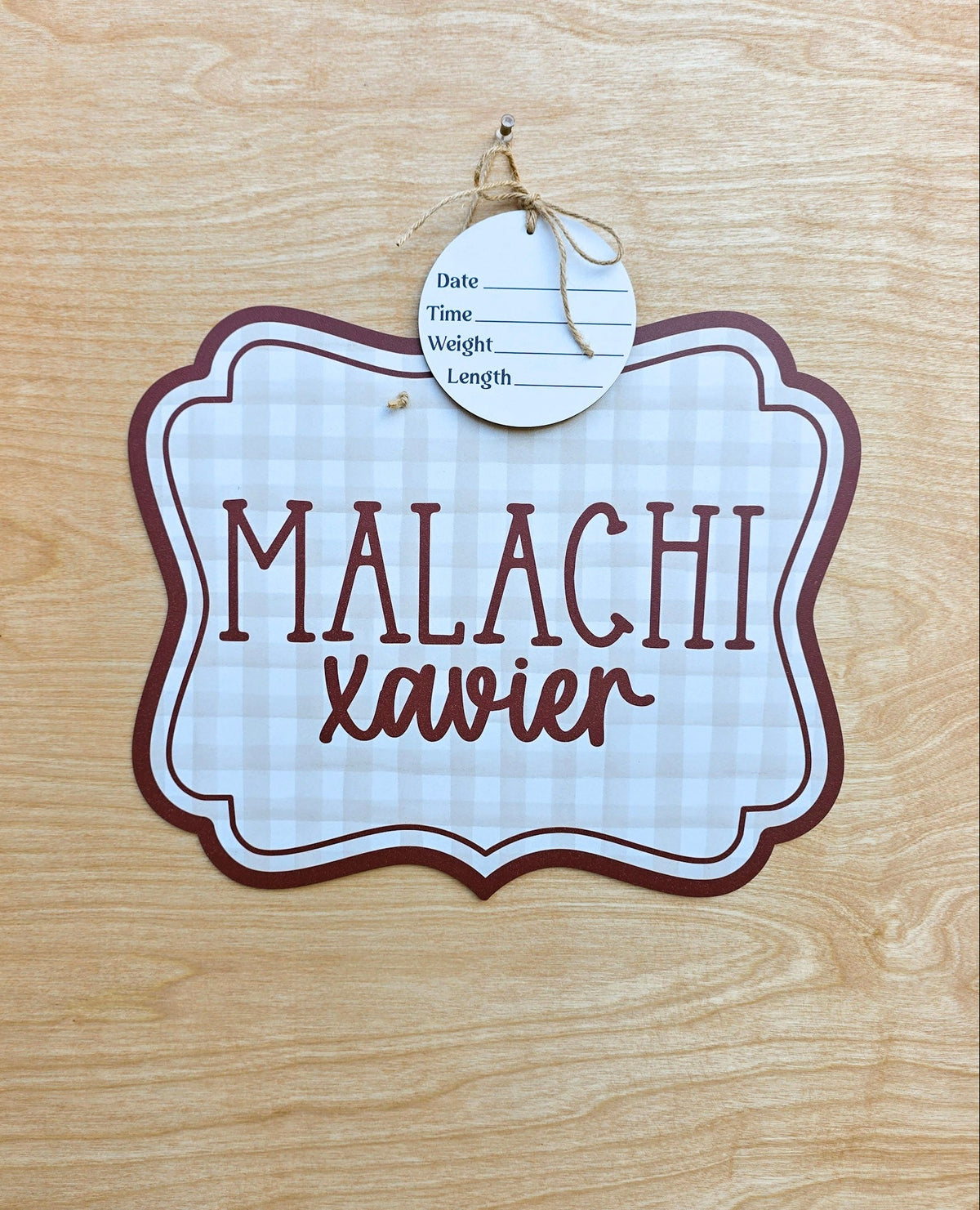 Personalized neutral gingham hospital door hanger with burgundy border, scalloped plaque shape, custom baby name and detachable birth stat round