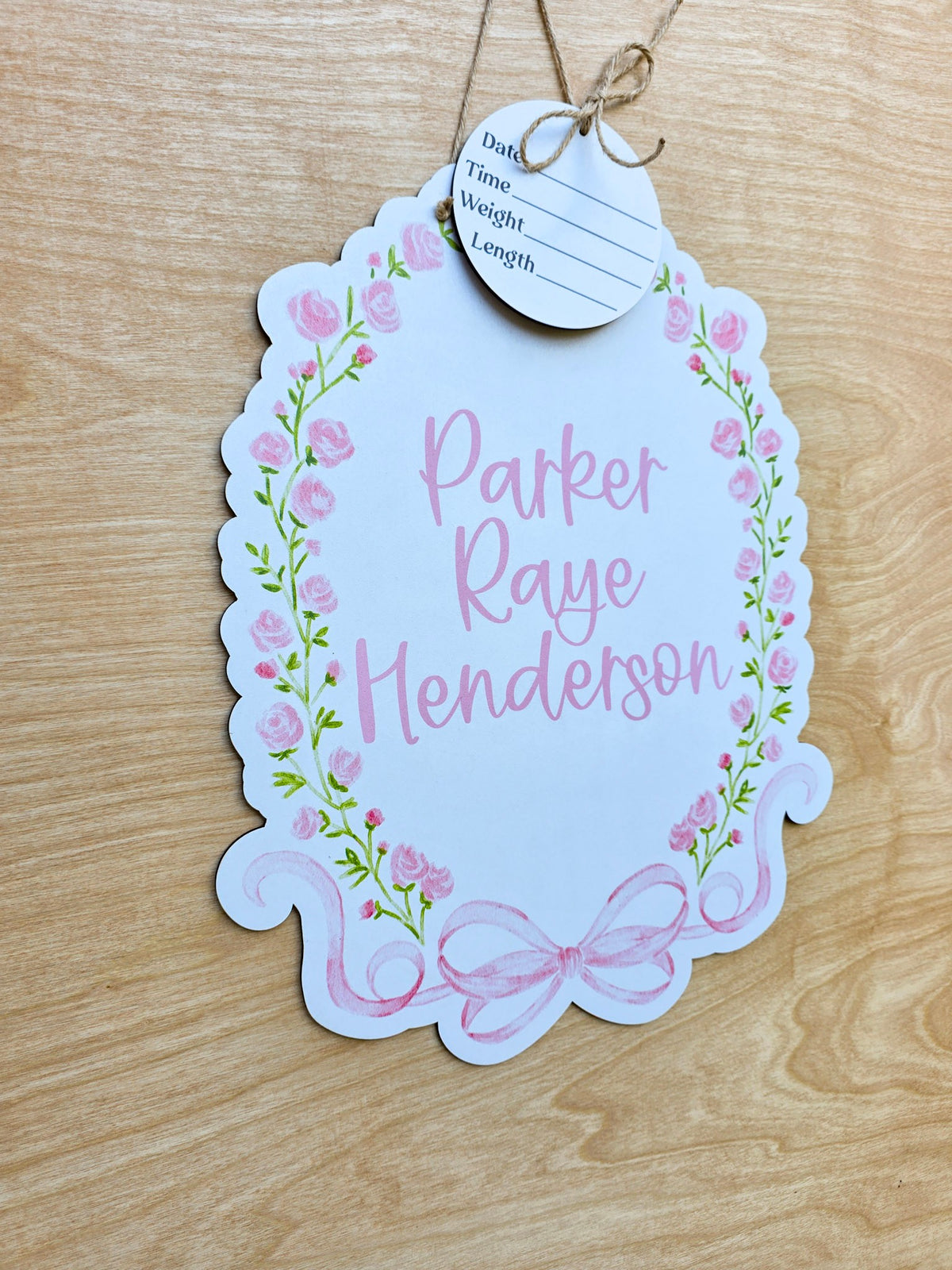 Watercolor pink rose garland and green vines on custom baby hospital door sign