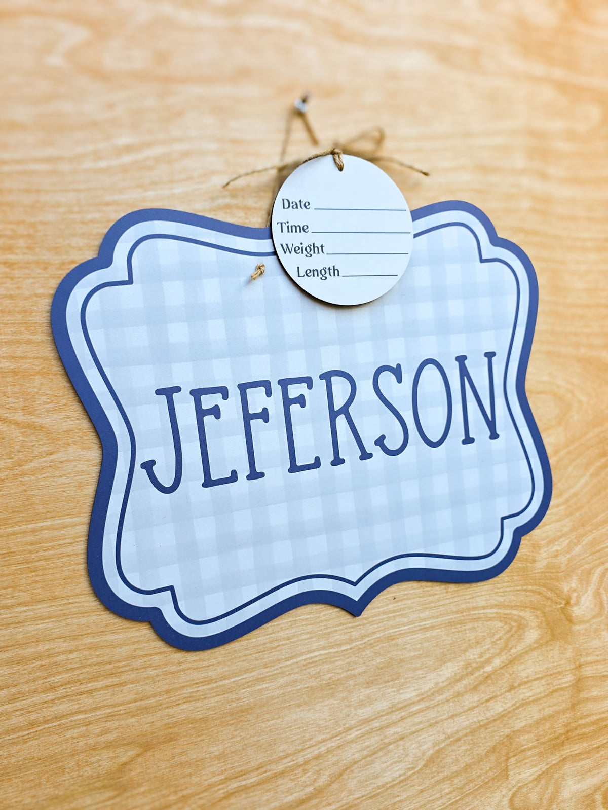 Decorative scalloped edge of personalized blue gingham hospital door sign
