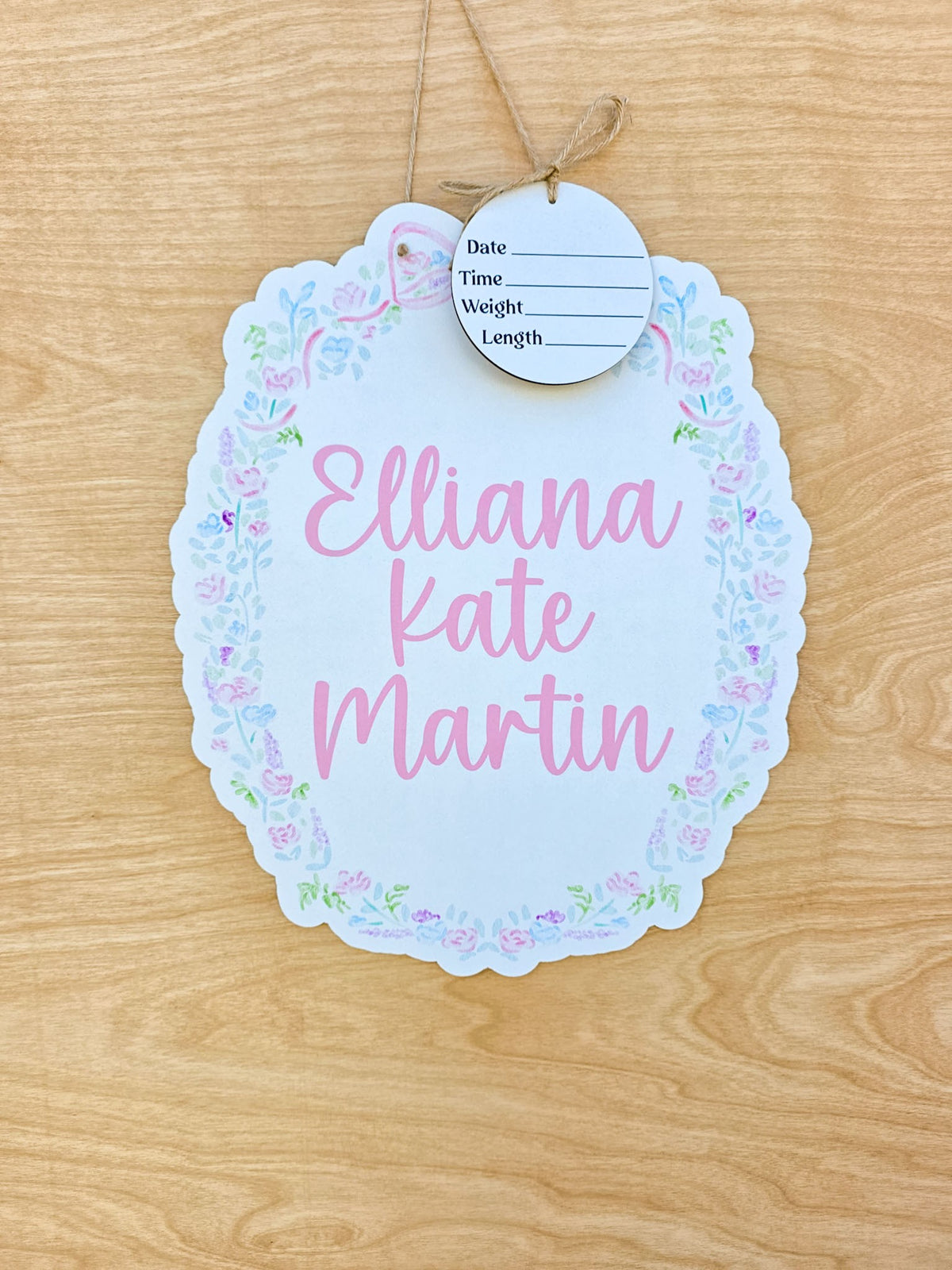 Personalized pastel floral scalloped hospital door hanger with pink baby name and detachable birth announcement round